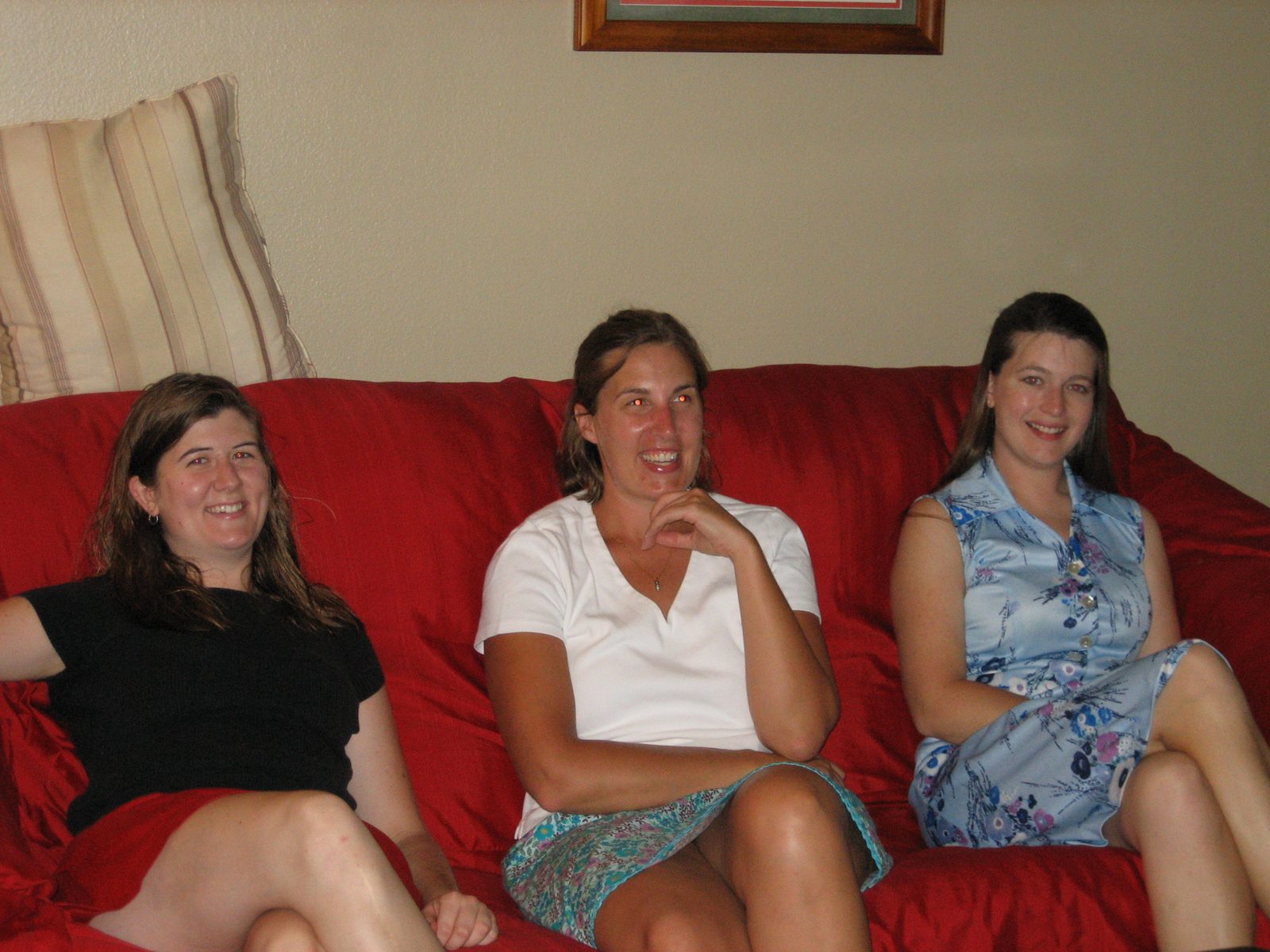 Carrie, Lisa, and Kim on Katie's big red couch