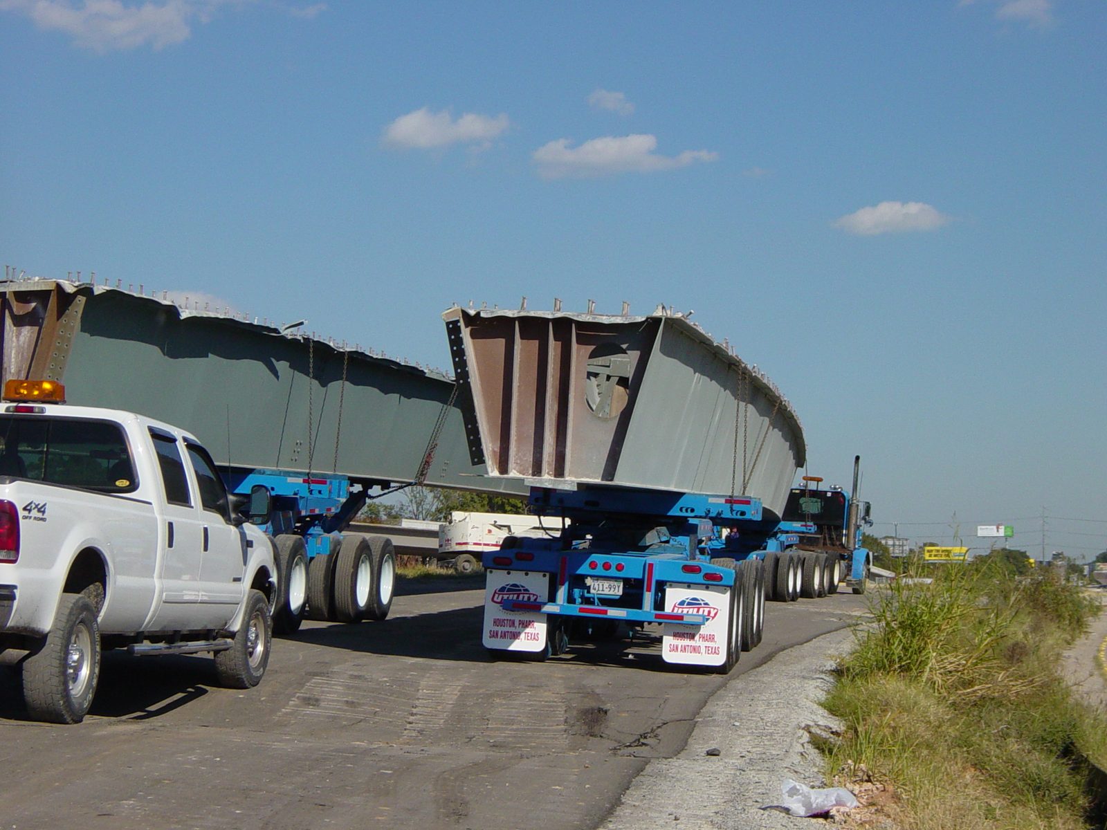 Back of girders on trucks.