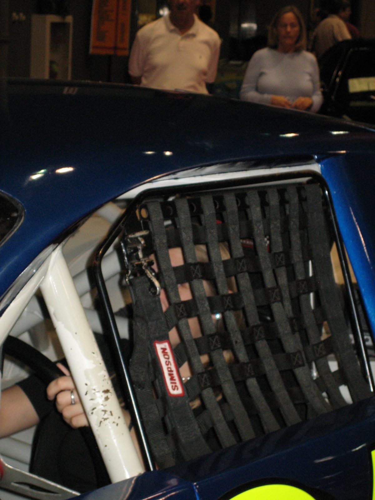 Catherine driving the fake racecar.  She won the race!