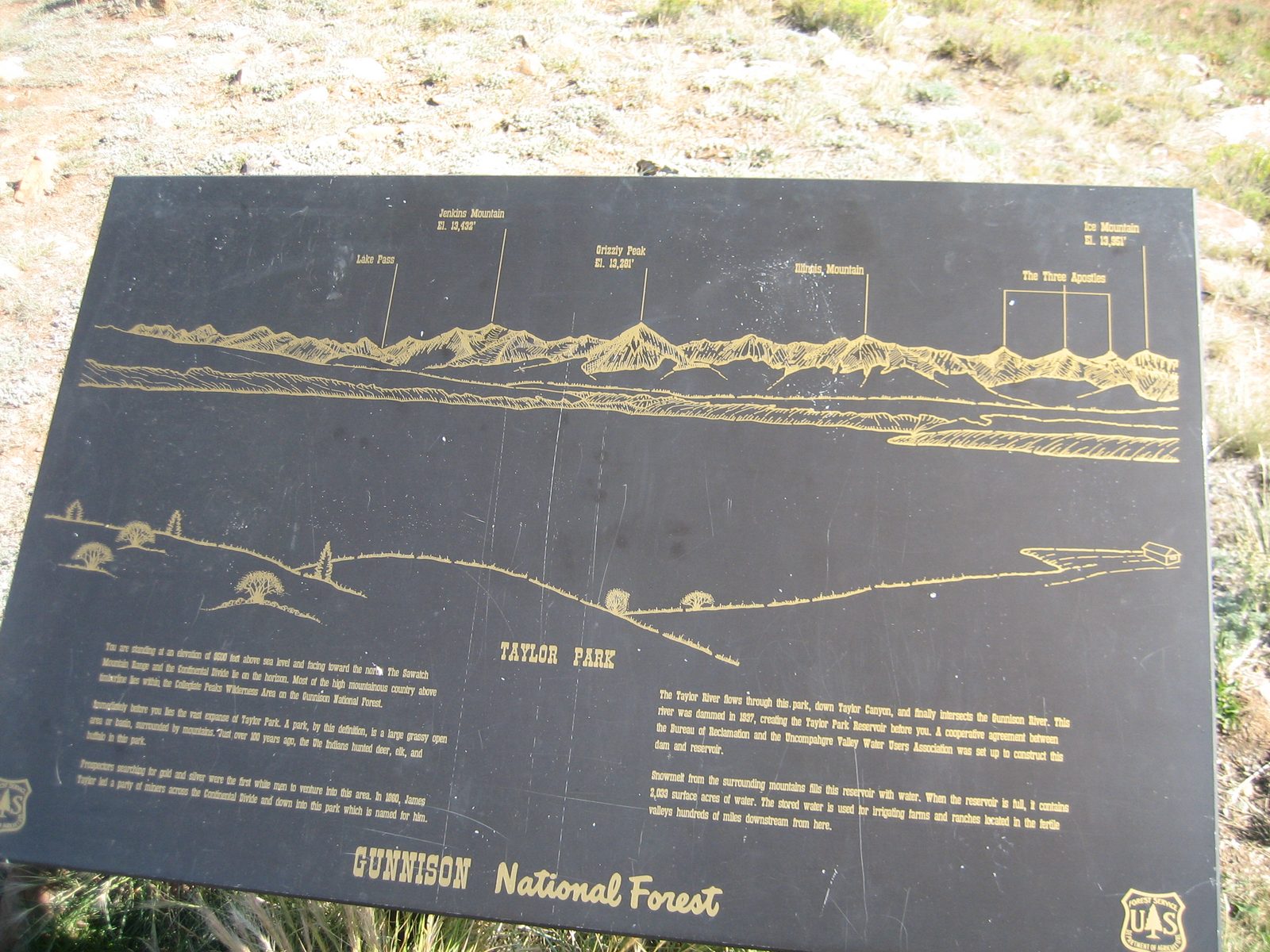 Information on the reservoir and the mountains in the distance