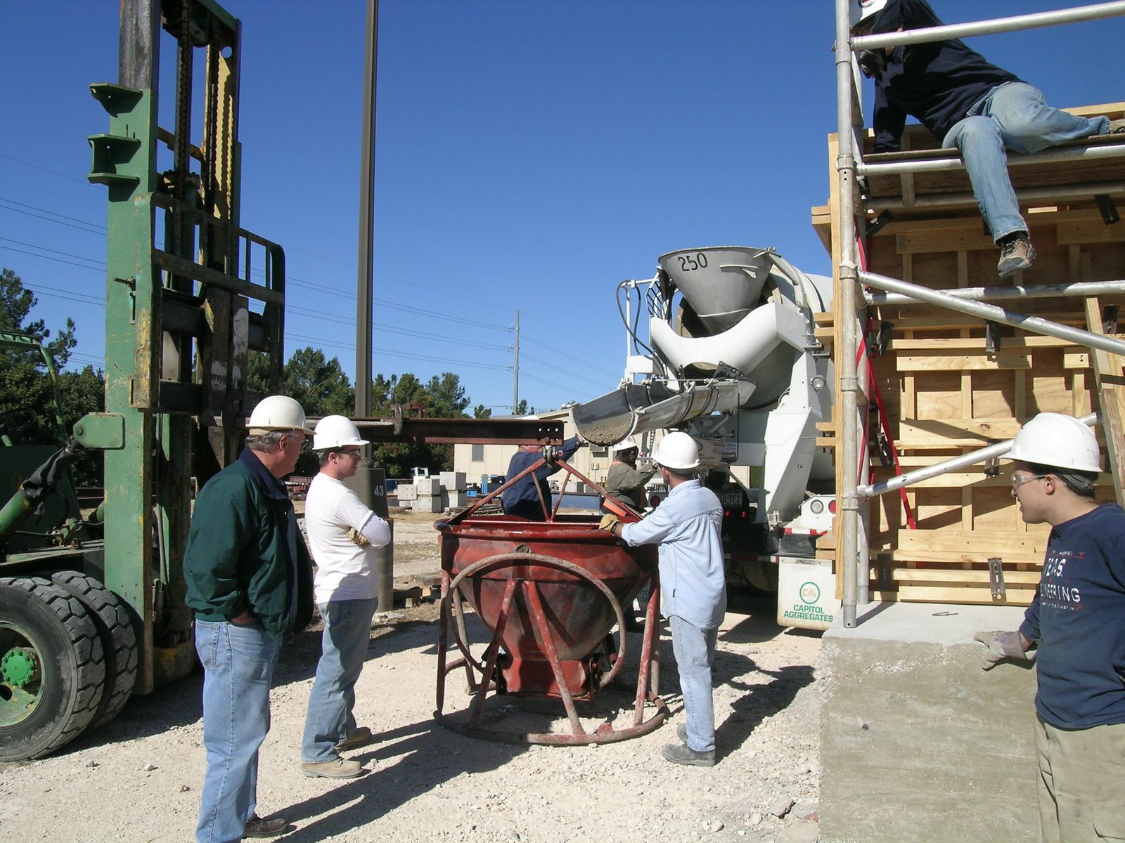 Casting the south wall.  Left to right: Dr. Frank, Lewis, people in the background, Tim,...