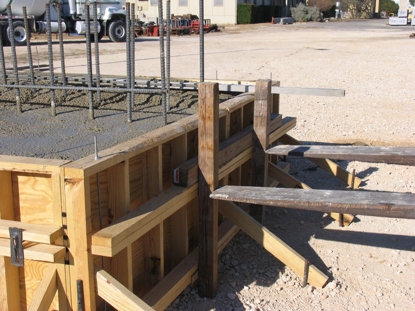 Ack!  The forms split in the middle; the forklift is holding it together.  Concrete is heavy!