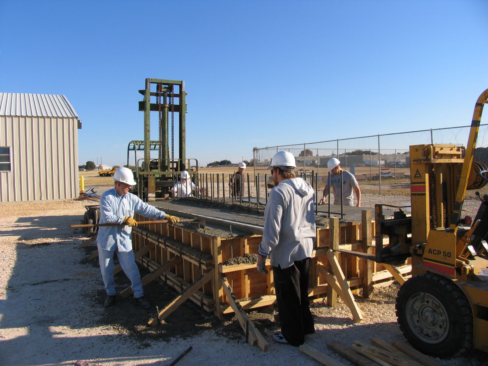 And the yellow forklift is holding this end together.  Tim's finishing off the top.  [I'm on the...
