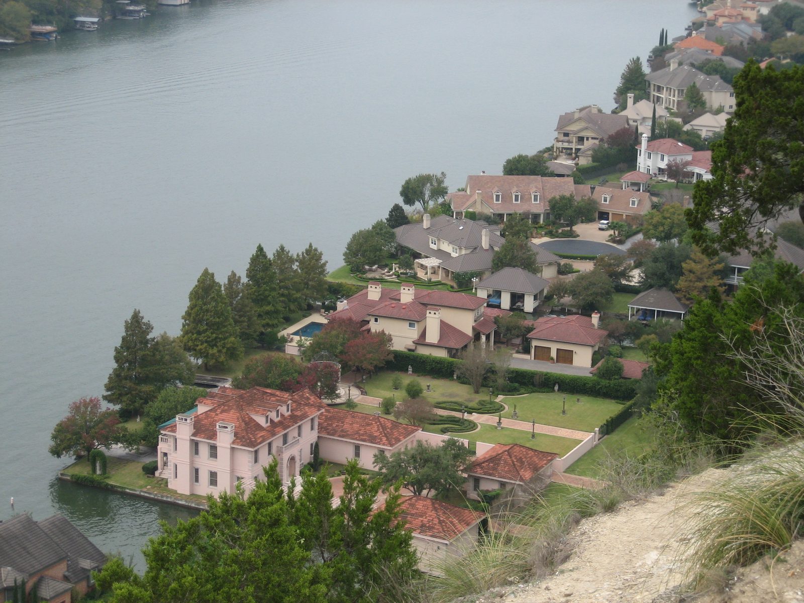 Looking down on some of the houses on the shore, most of which feature two-boat garages.