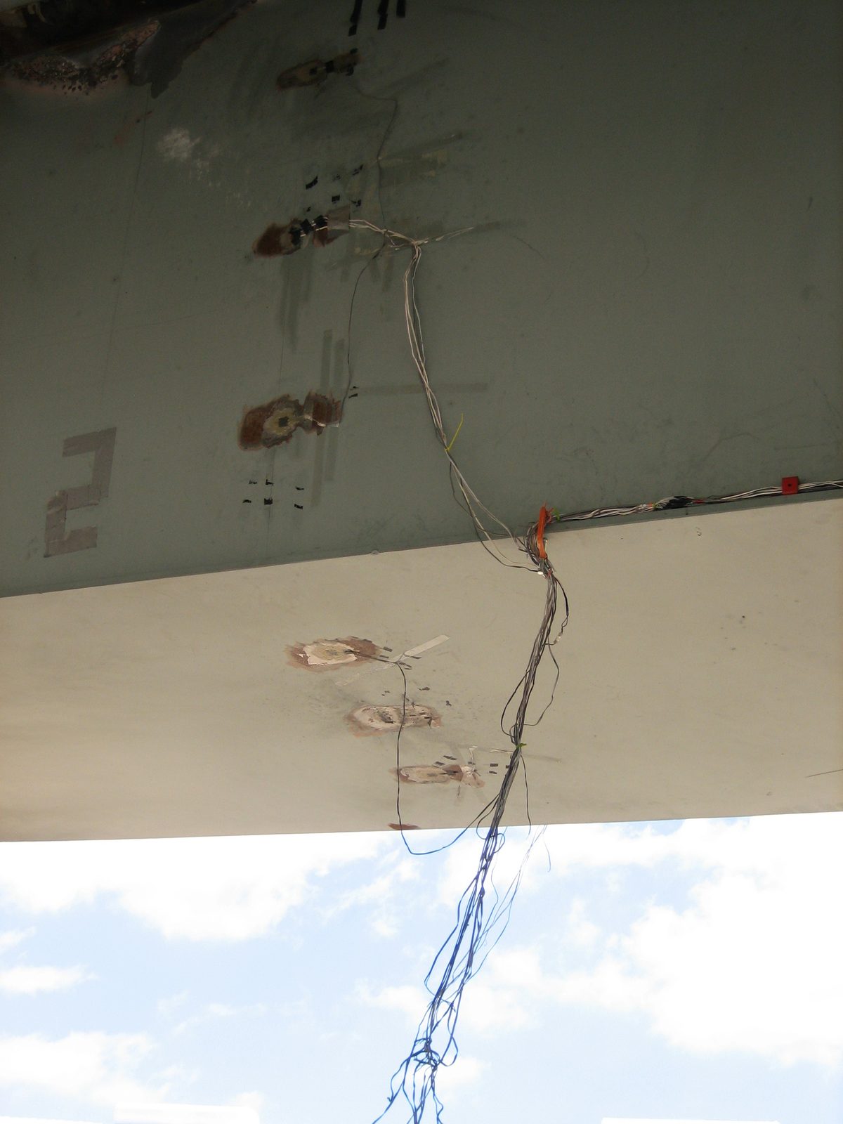 Ripped data wires.  Most likely, they ripped from explosive debris coming out (visible in the...