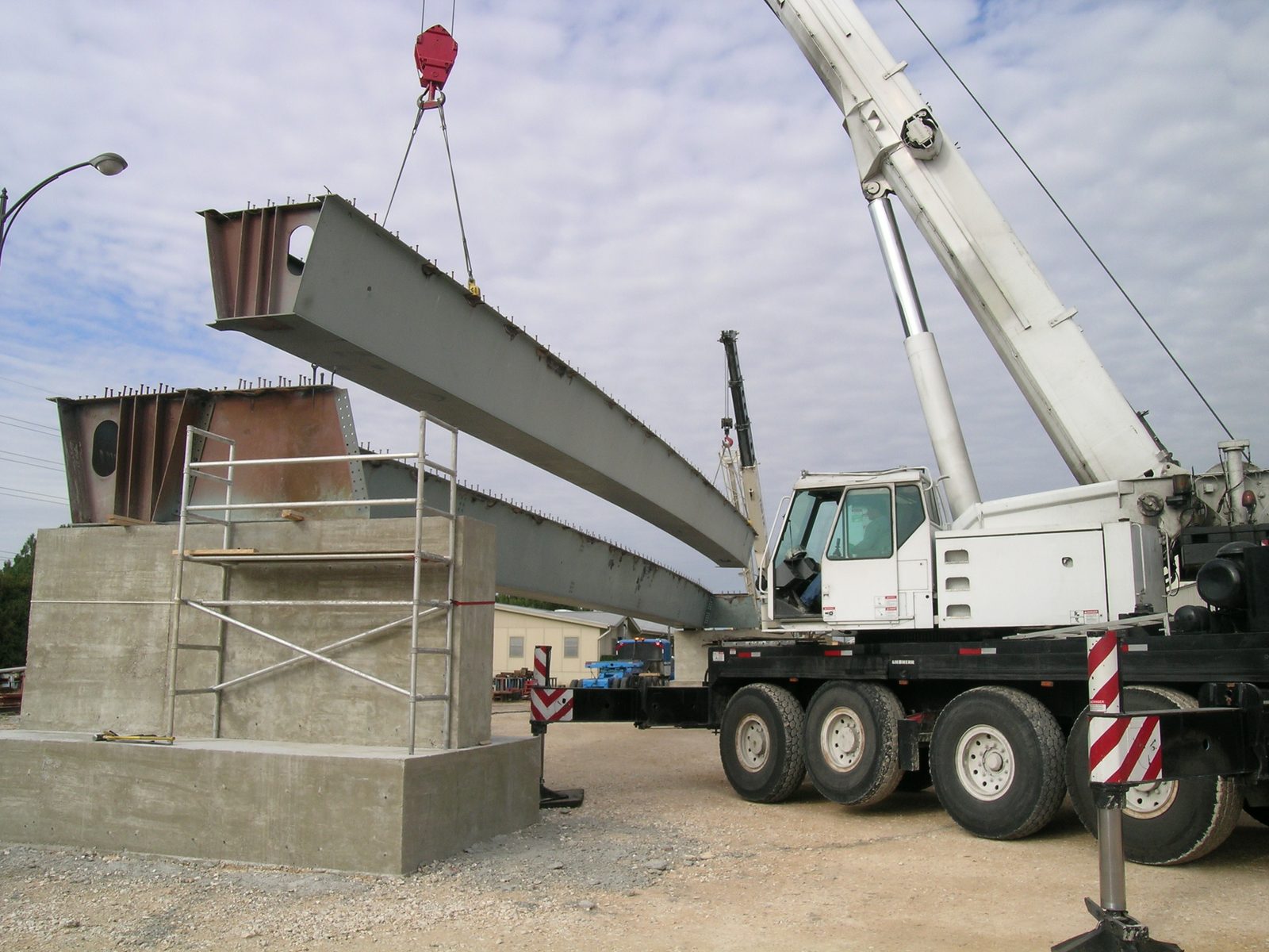 The second girder as it is lowered into place (note: the bottom of that girder must tuck...