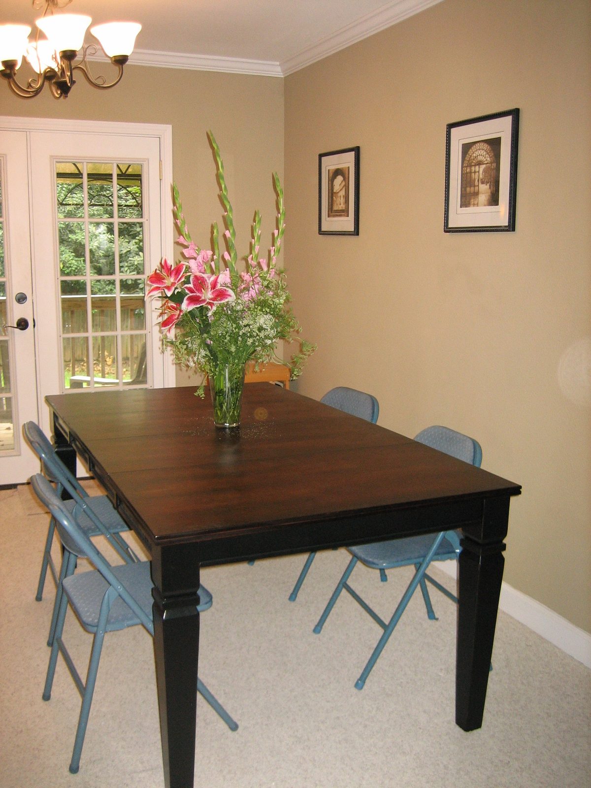 Dining table, temporary seating, and Catherine's flowers
