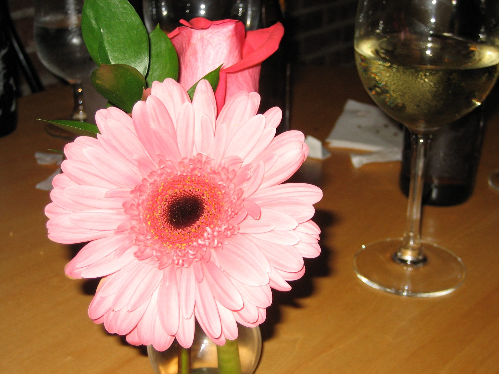Pretty flower.  And glass of wine.