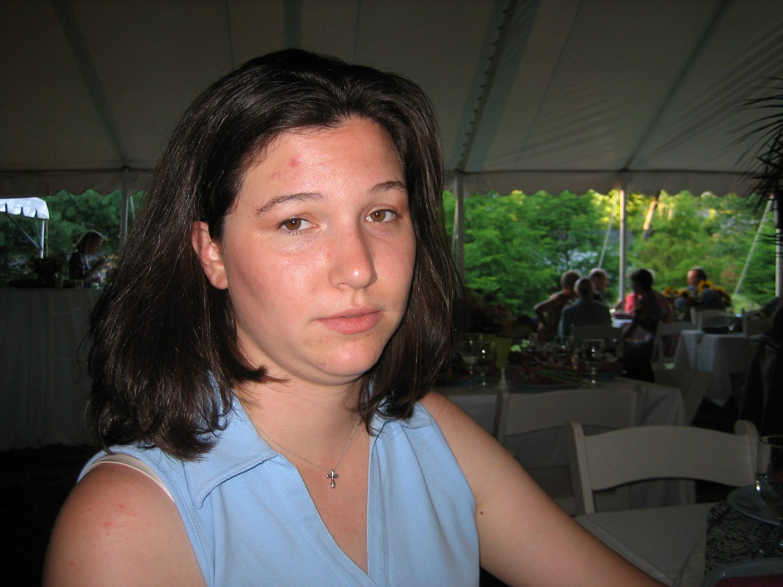 Kelly is having nothing of Catherine's photo-taking at the reception