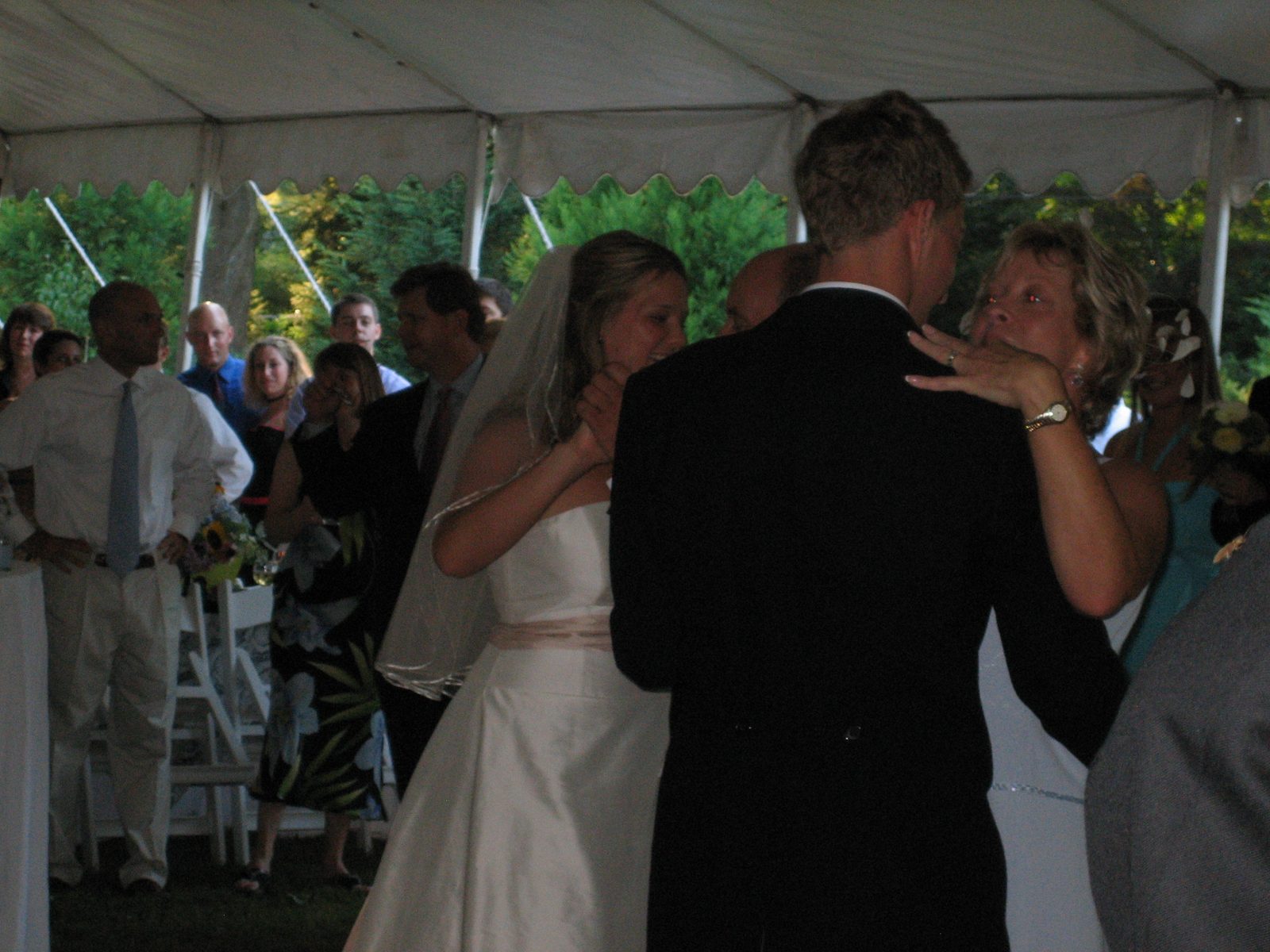 Maggy and Andy dance with Andy's mother and father