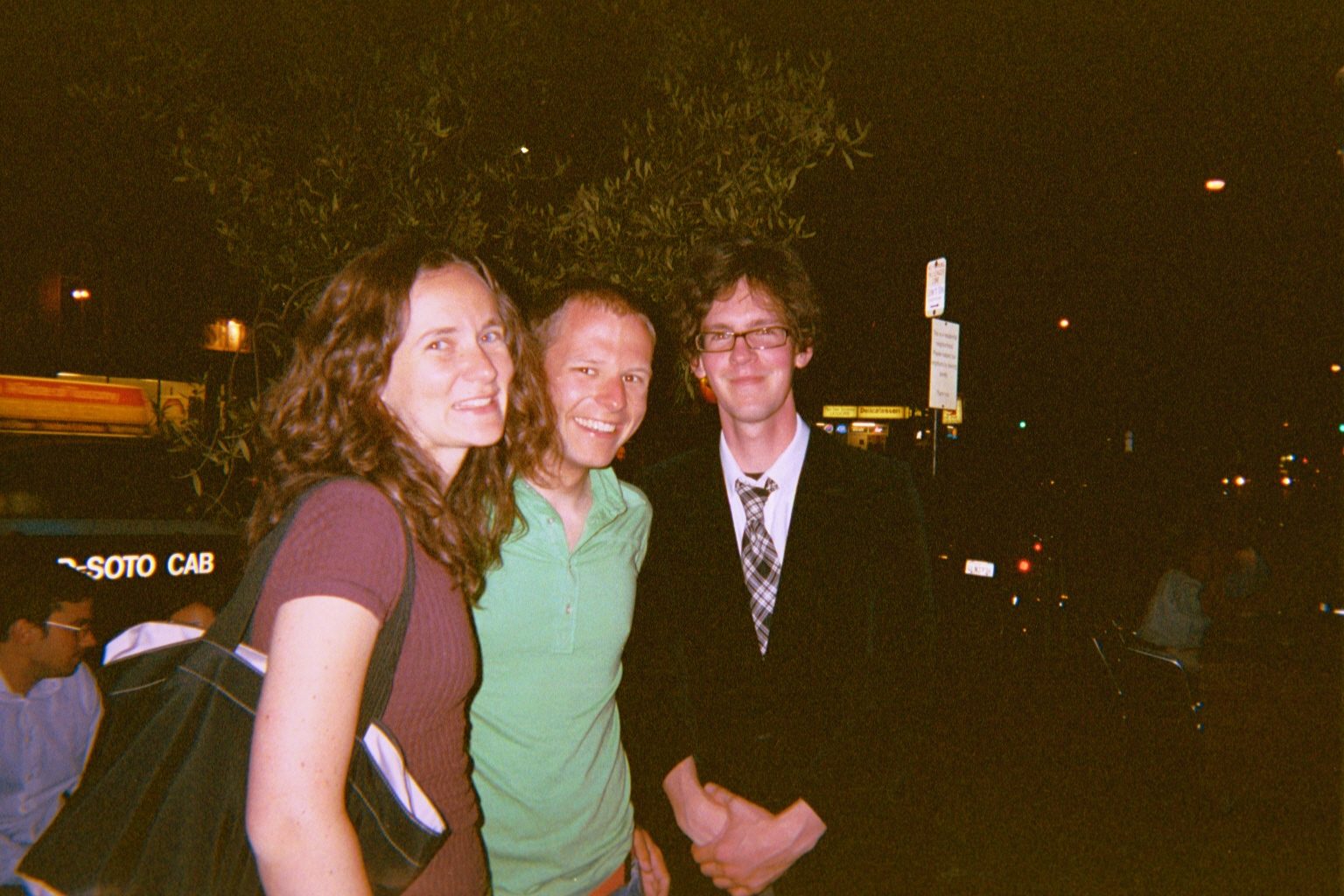 Rachel, John, and Jimmy outside the restaurant.