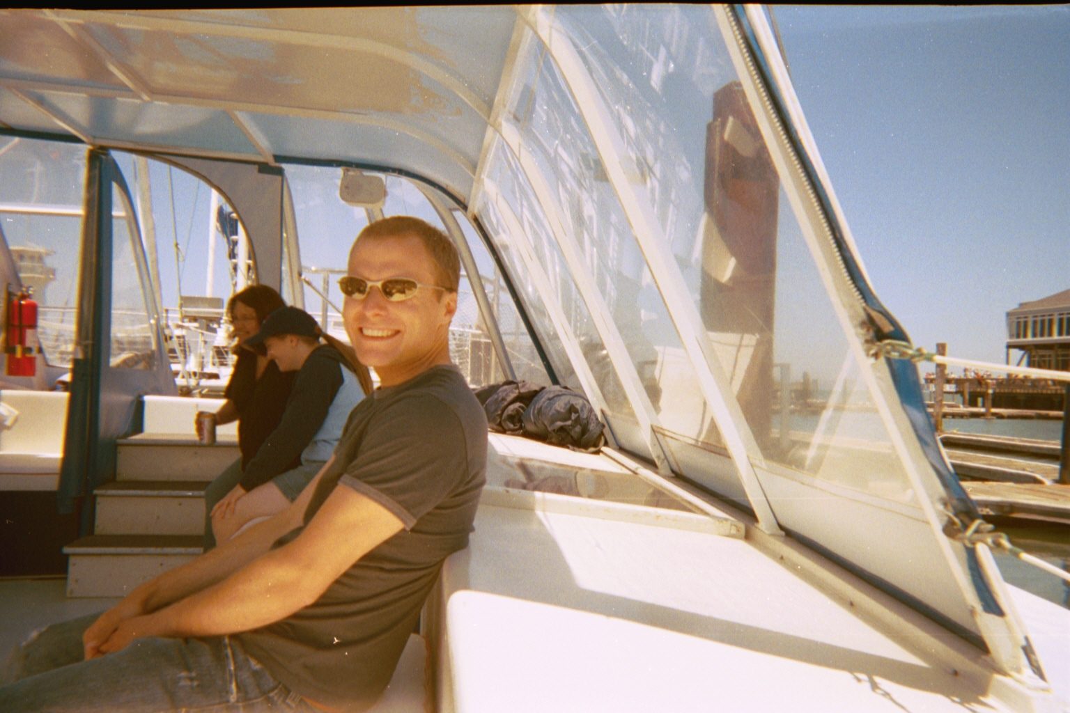 John in the happy warmth of the boat.