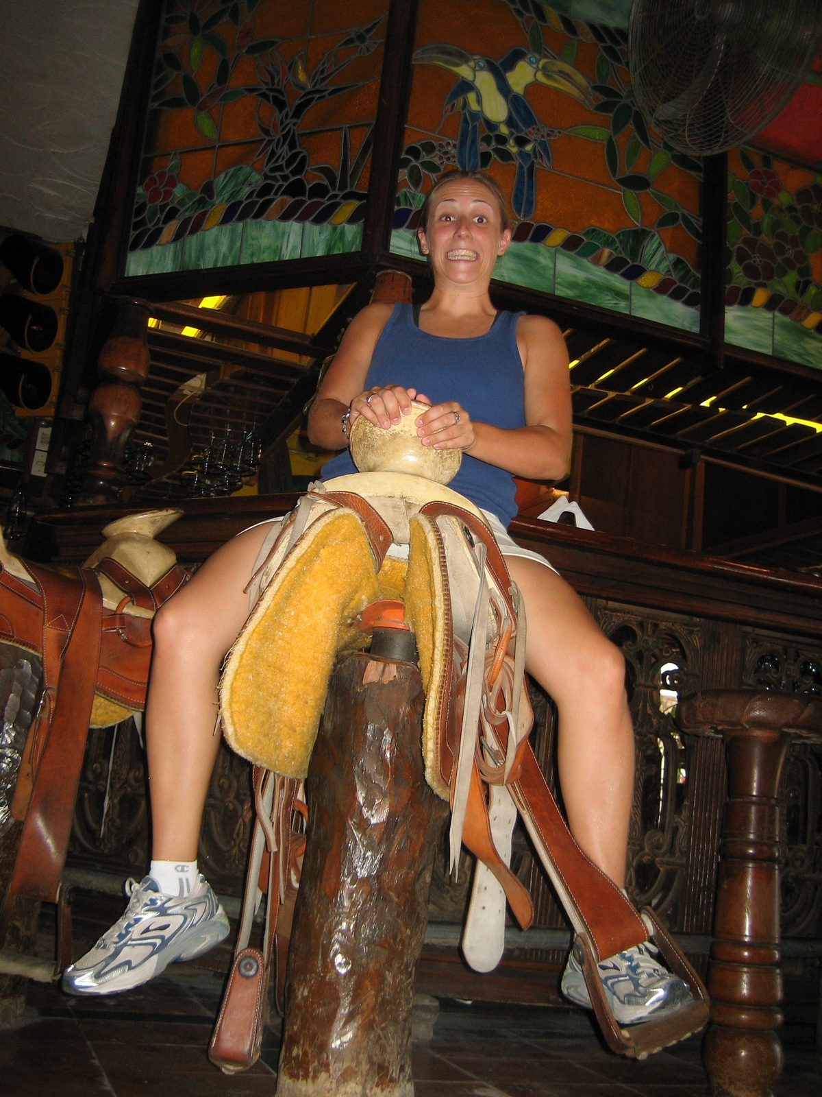 Catherine tries out the barstools.  As they rocked forward and back, it'd probably be bad to sit...
