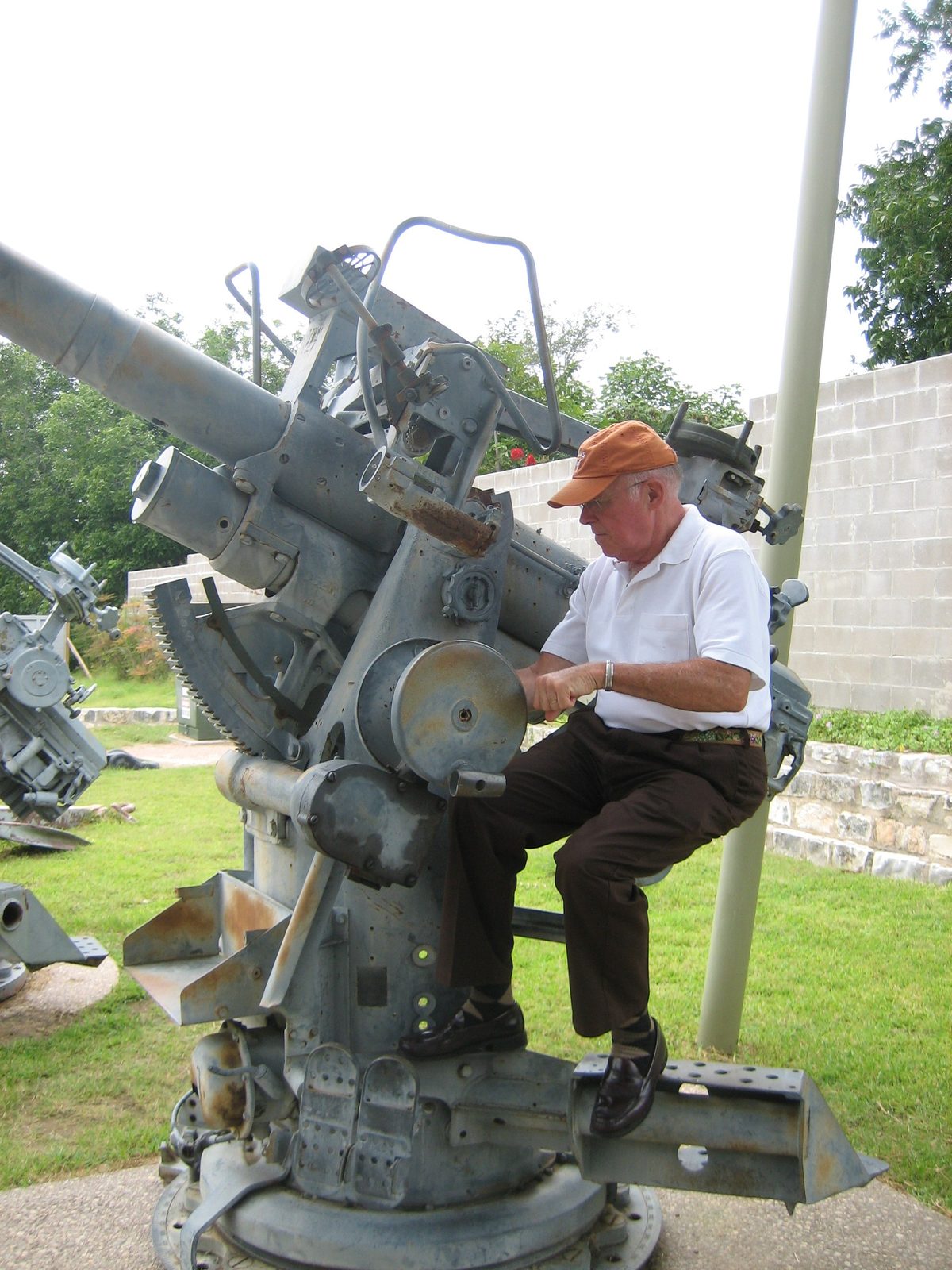 Dad playing with a big gun.
