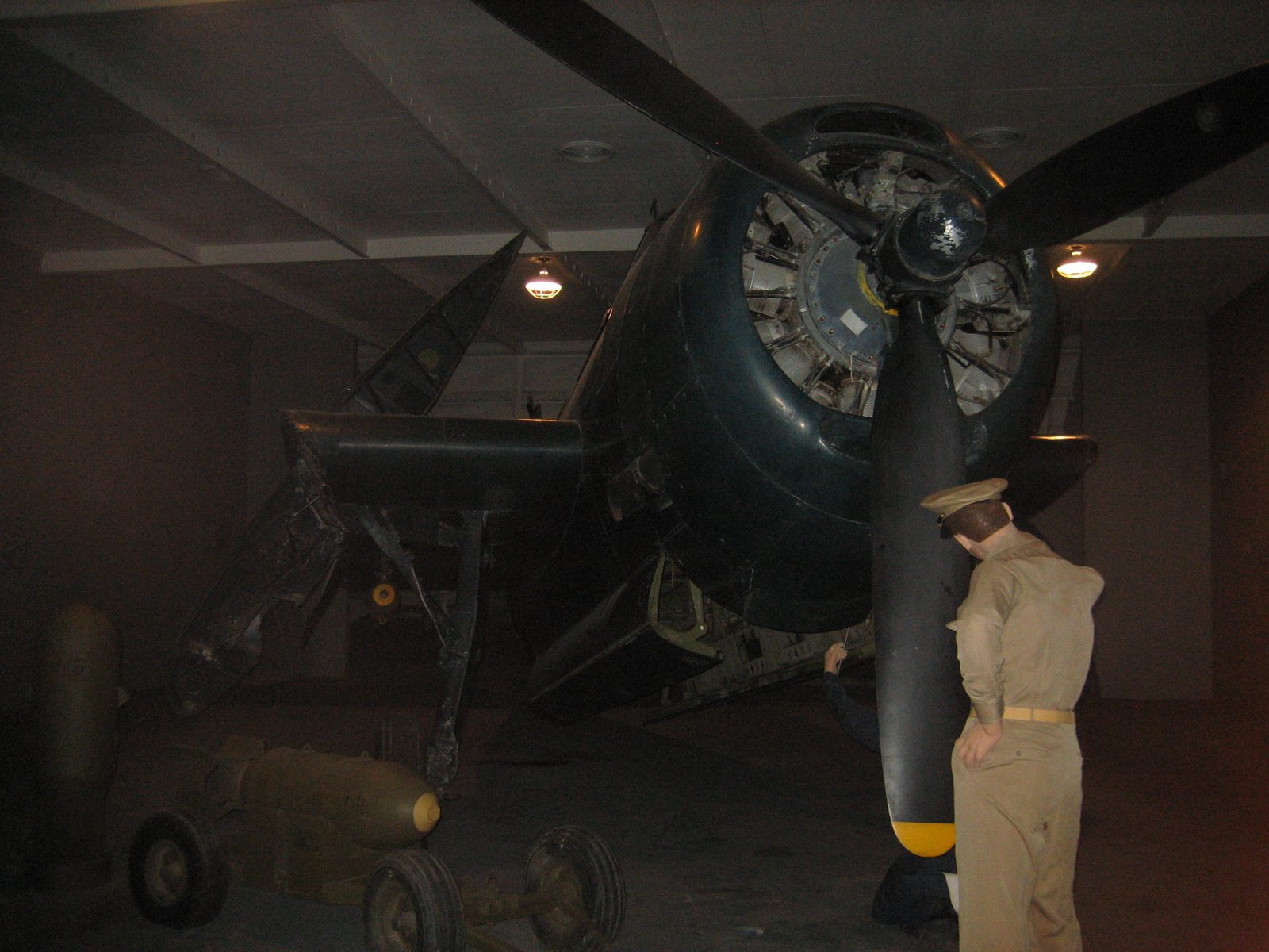 An Avenger dive-bomber, in the "lower deck" of a "aircraft carrier".