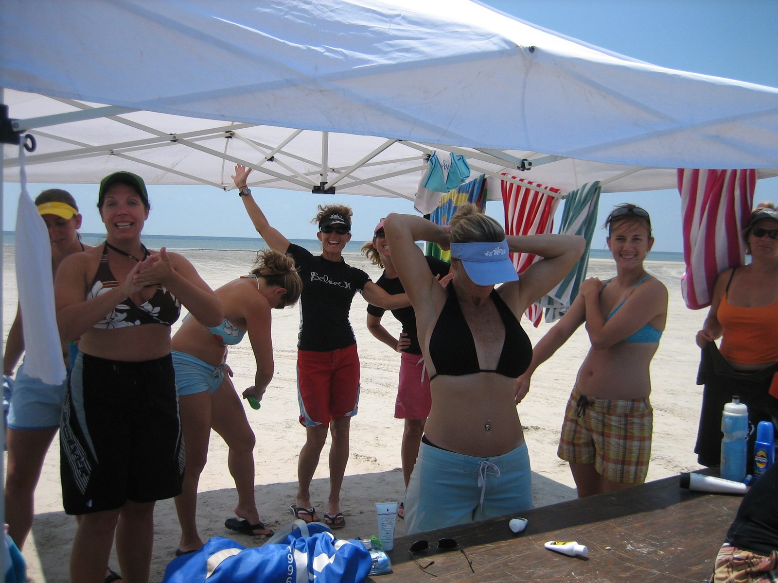 Cliff said there should be photographs of 12 women standing around putting suntan lotion on...