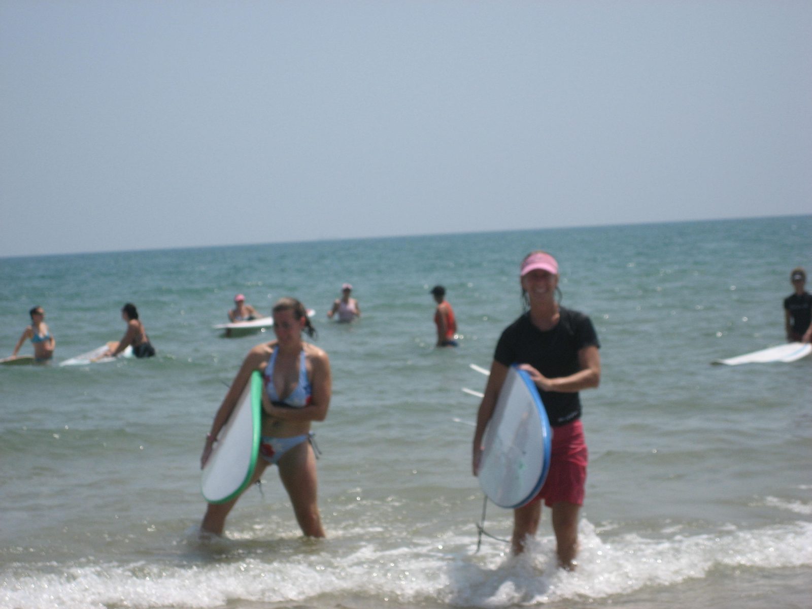 Jules and Heather come out of the water.