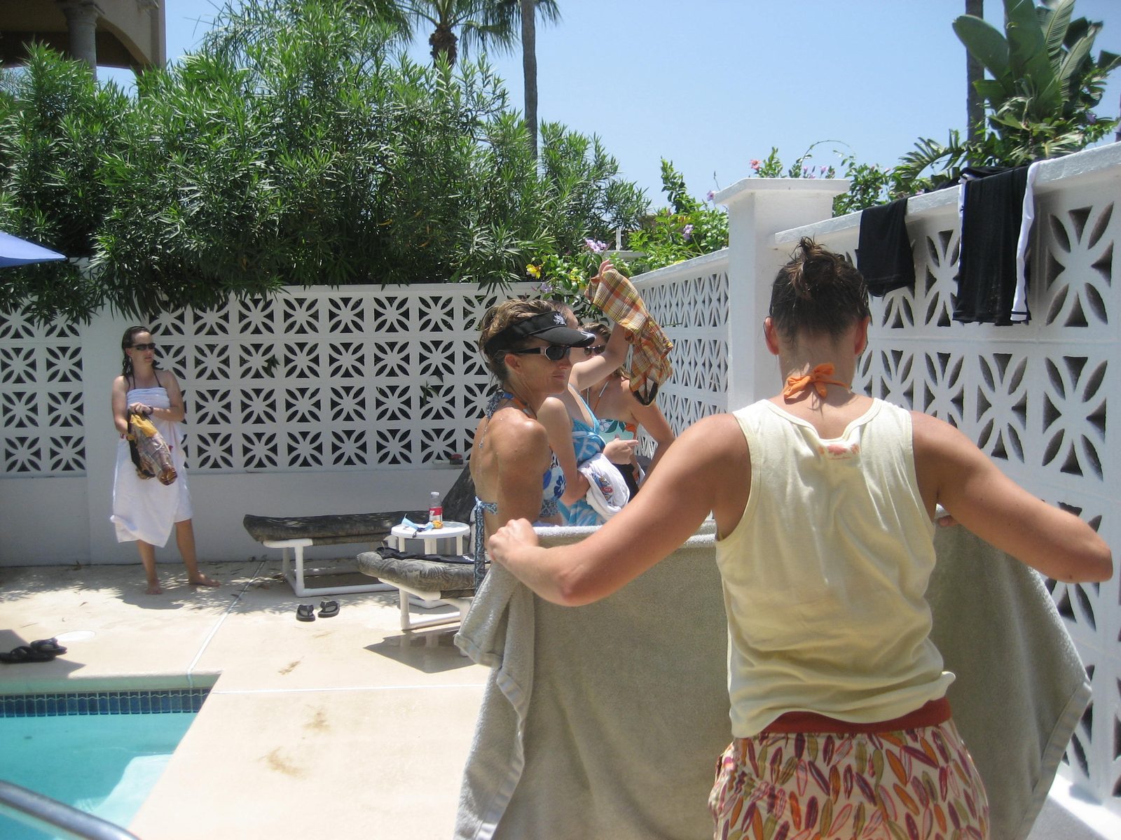 At Gretchen's pool, hanging stuff up to dry.