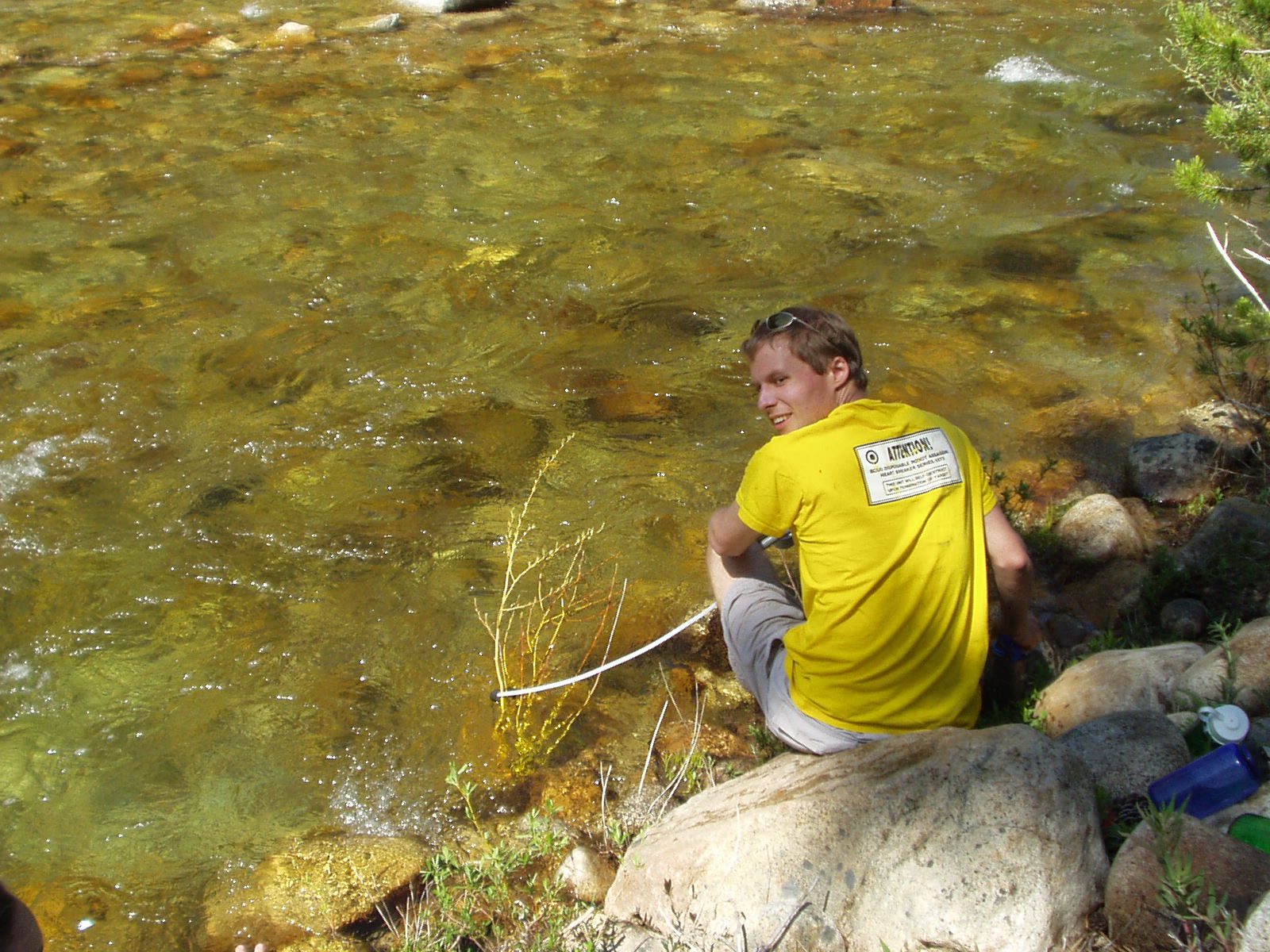 John fetching water from the stream.  