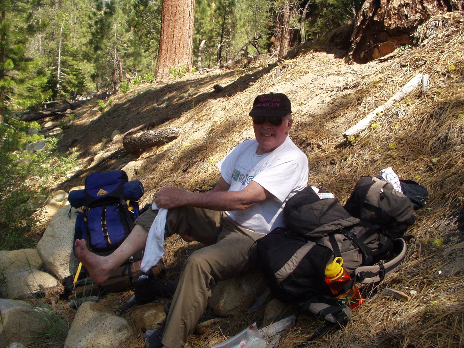 Dad drying off his feet after our river ford.
