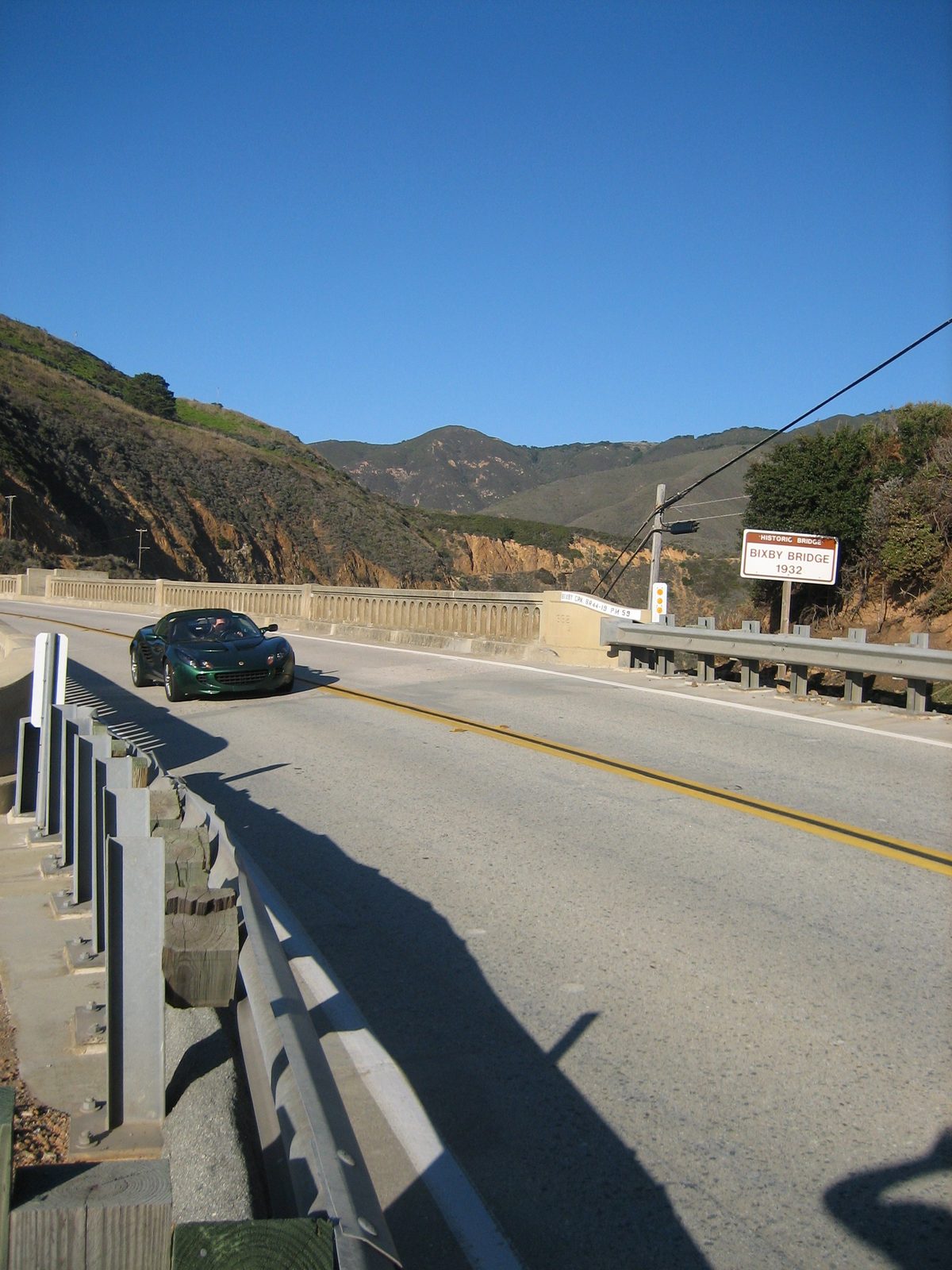 John driving le Lotus across the Bixby Bridge.