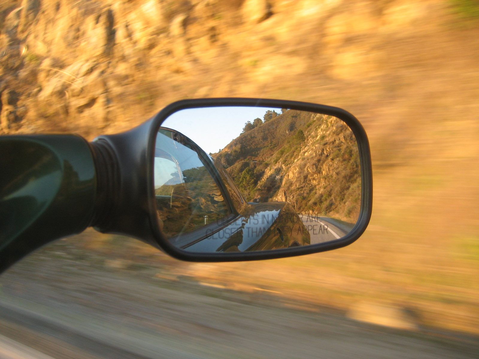 I call this one "Objects In Mirror Are Closer Than They Appear".  Think about it.  Yeah. ...