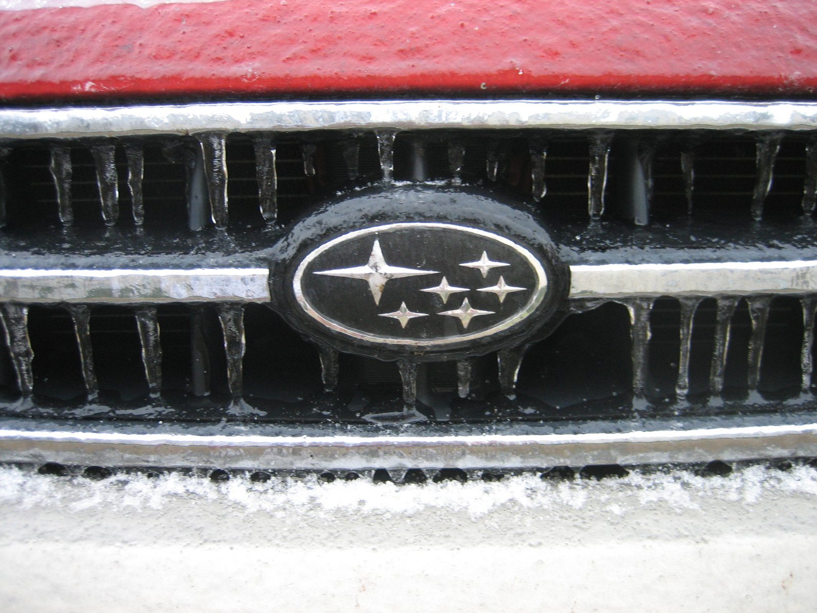 Icicles drip off the front grill of Le Subaru.
