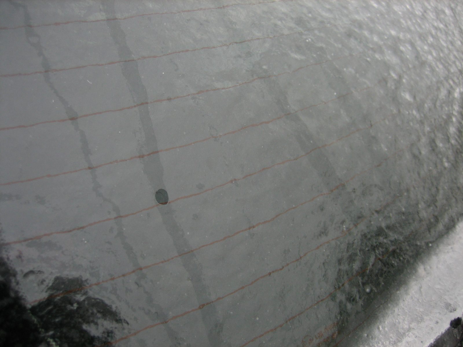 Water droplets run down back windshield on the inside of the ice.  I took a movie of this too,...