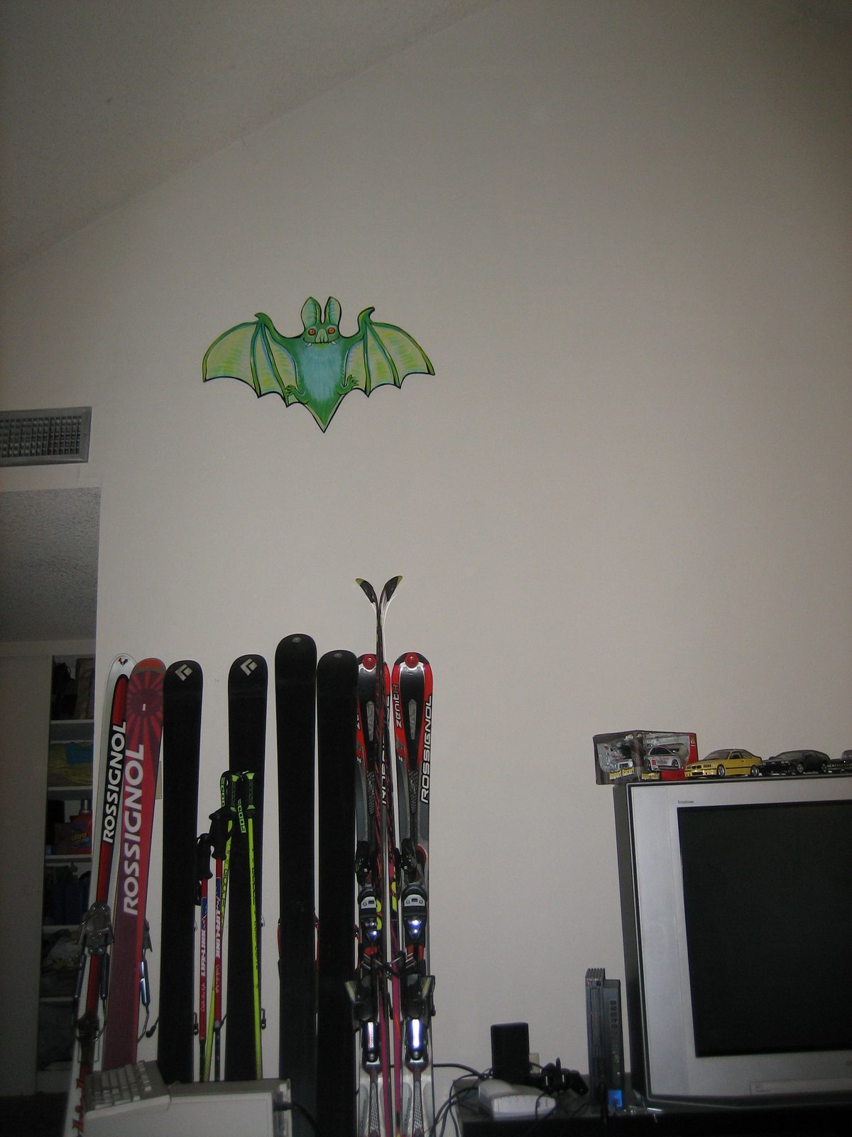 Mr. Bat watches over the living room and protects the skis.
