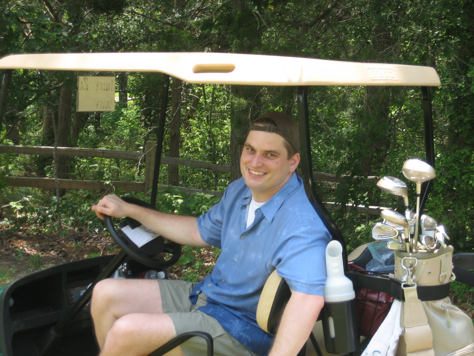 Austin chilling out in the golf cart.