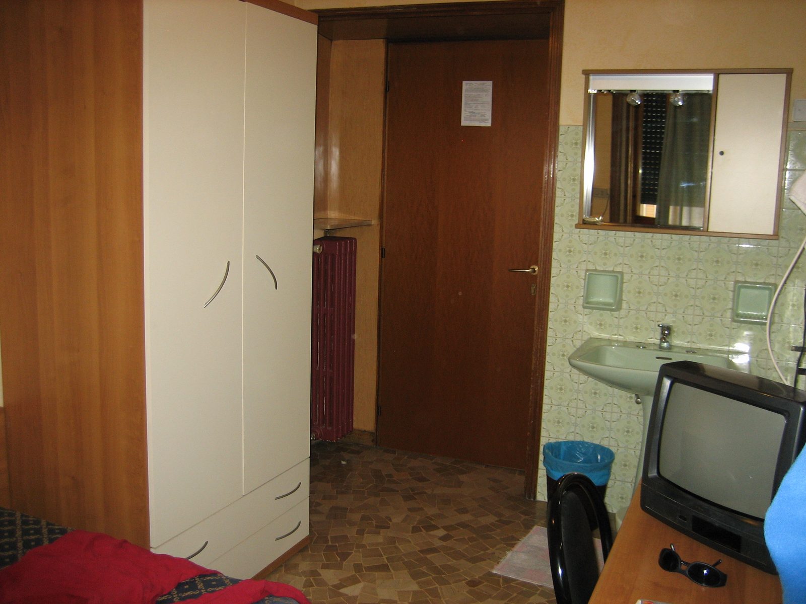 Doorway, wardrobe, and bathroom area.  All in all, a very good room for the price.