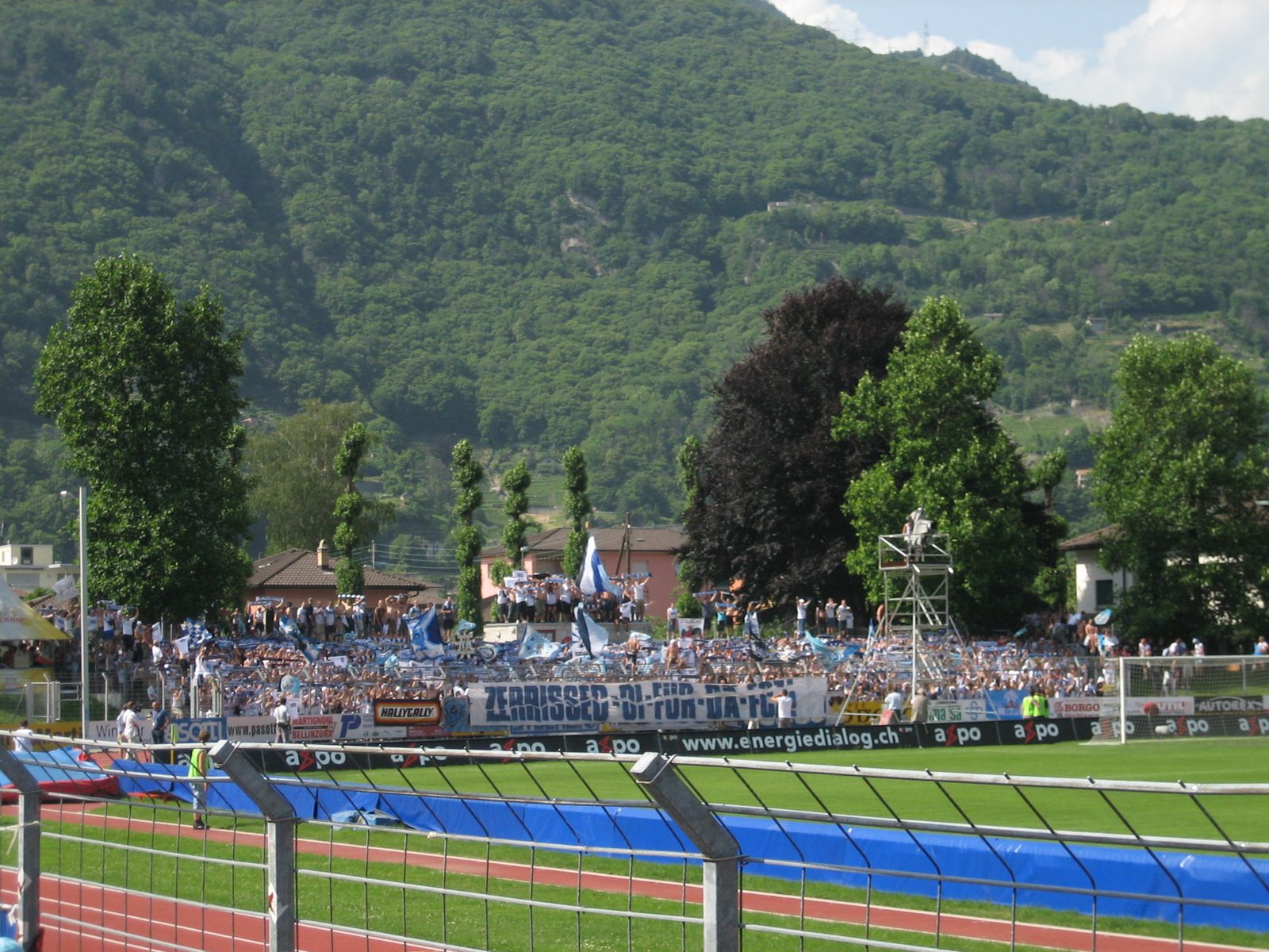 Zurich fans, contained to one end of the stadium, with police on either side.