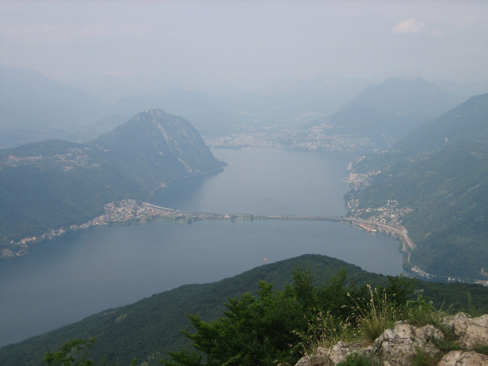Sadly, it was super-hazy the day of our climb.  The train from Riva to Lugano followed a track...
