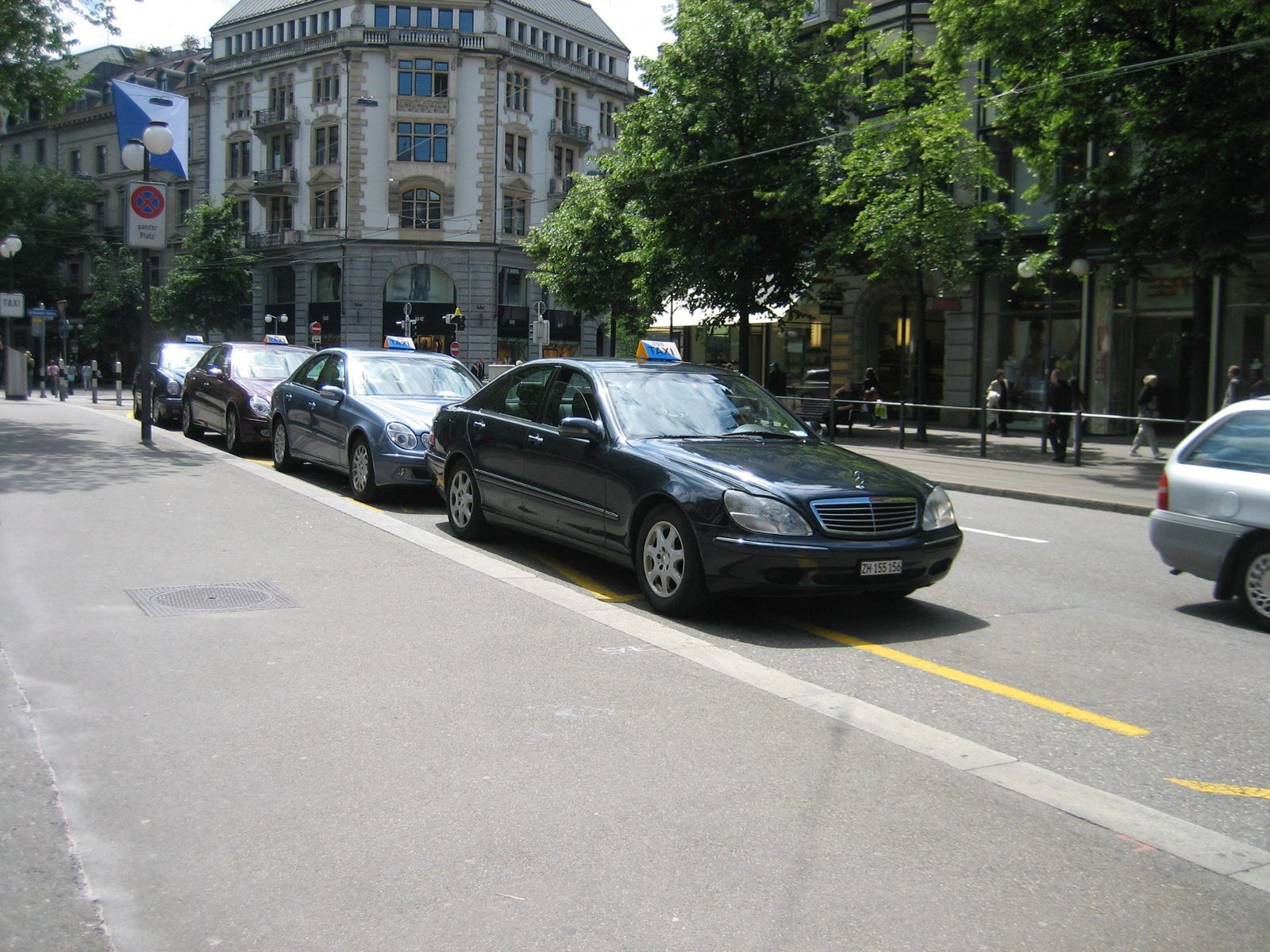 Mercedes taxis line up on the Bahnhofstrasse, the major shopping street through Zurich.