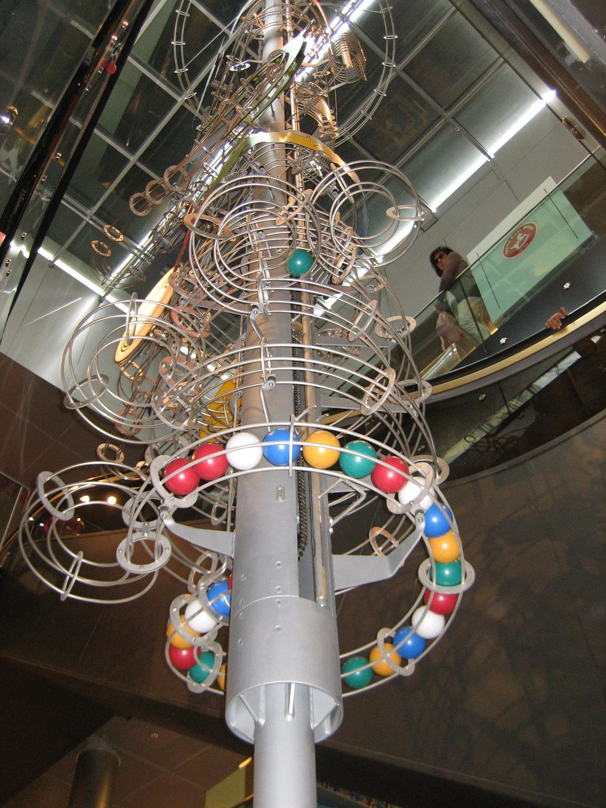 Giant ball-mover toy, multiple floors tall (see the escalators).  What were these sets called? ...