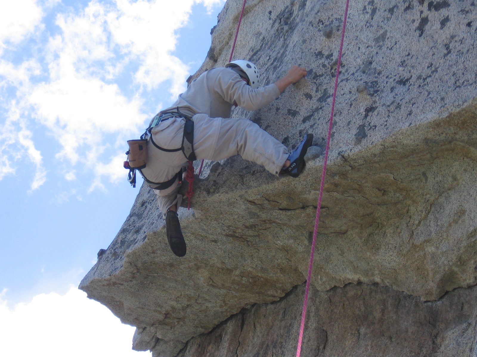 John getting over the roof on Over Easy (5.7) on Middle Spire.