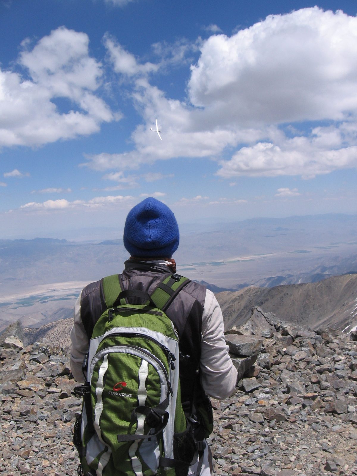 John, looking at the glider from the top of White Mountain Peak.