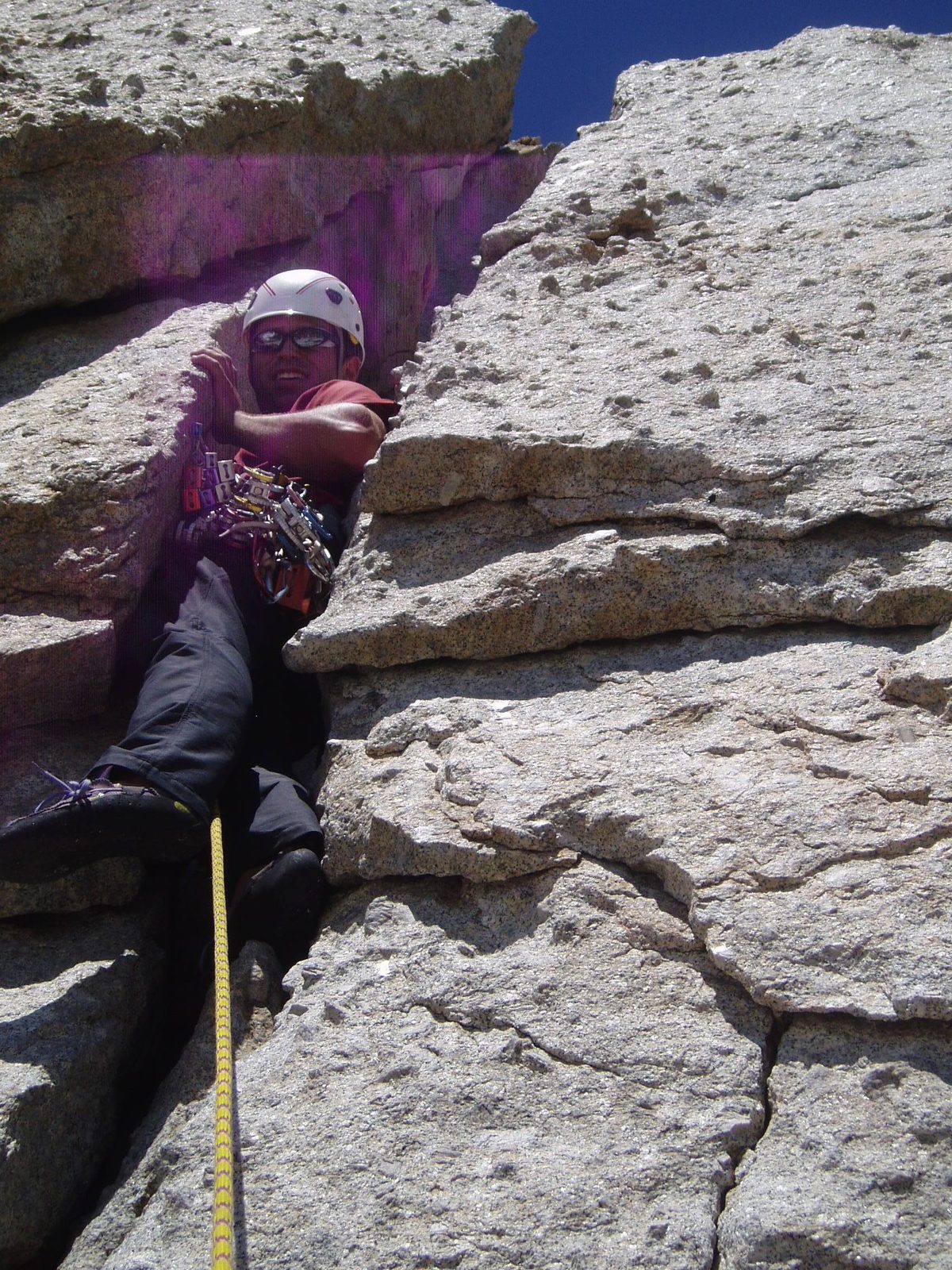 Colin, squeezing himself into the chimney at the start of the 4th pitch.