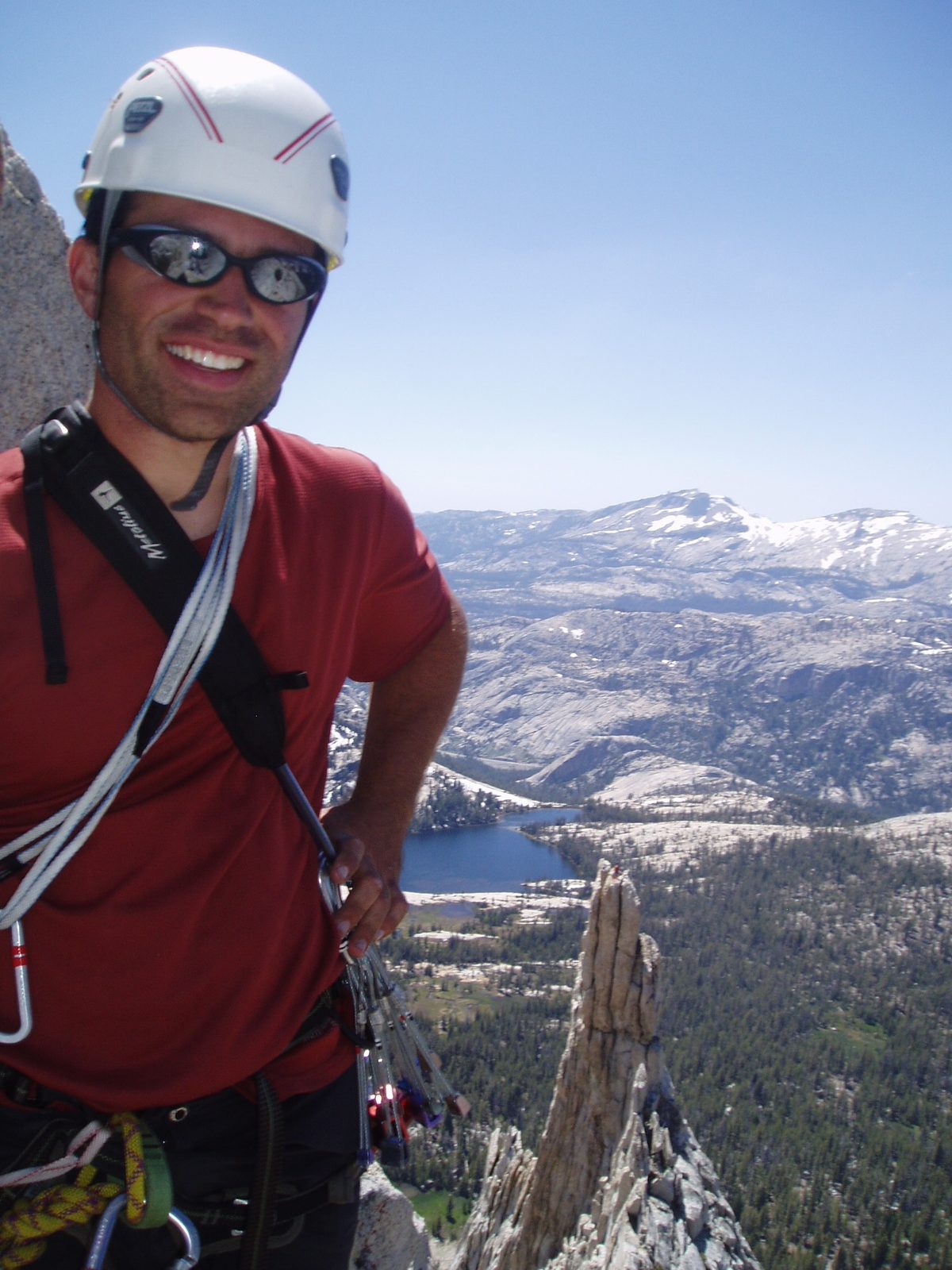 Colin twenty feet from the top of Cathedral Peak, with Eichorn's Pinnacle in the background (5.4...