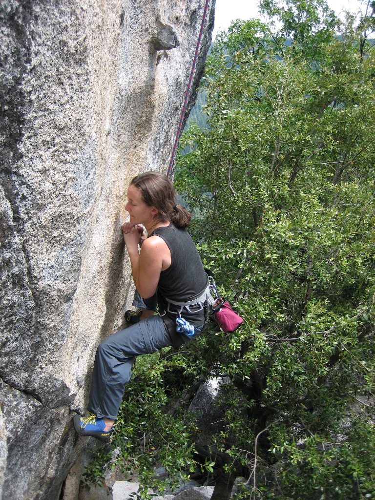 Rachel trying her hand on The Bowling Ball (5.10b) on The Blocks.