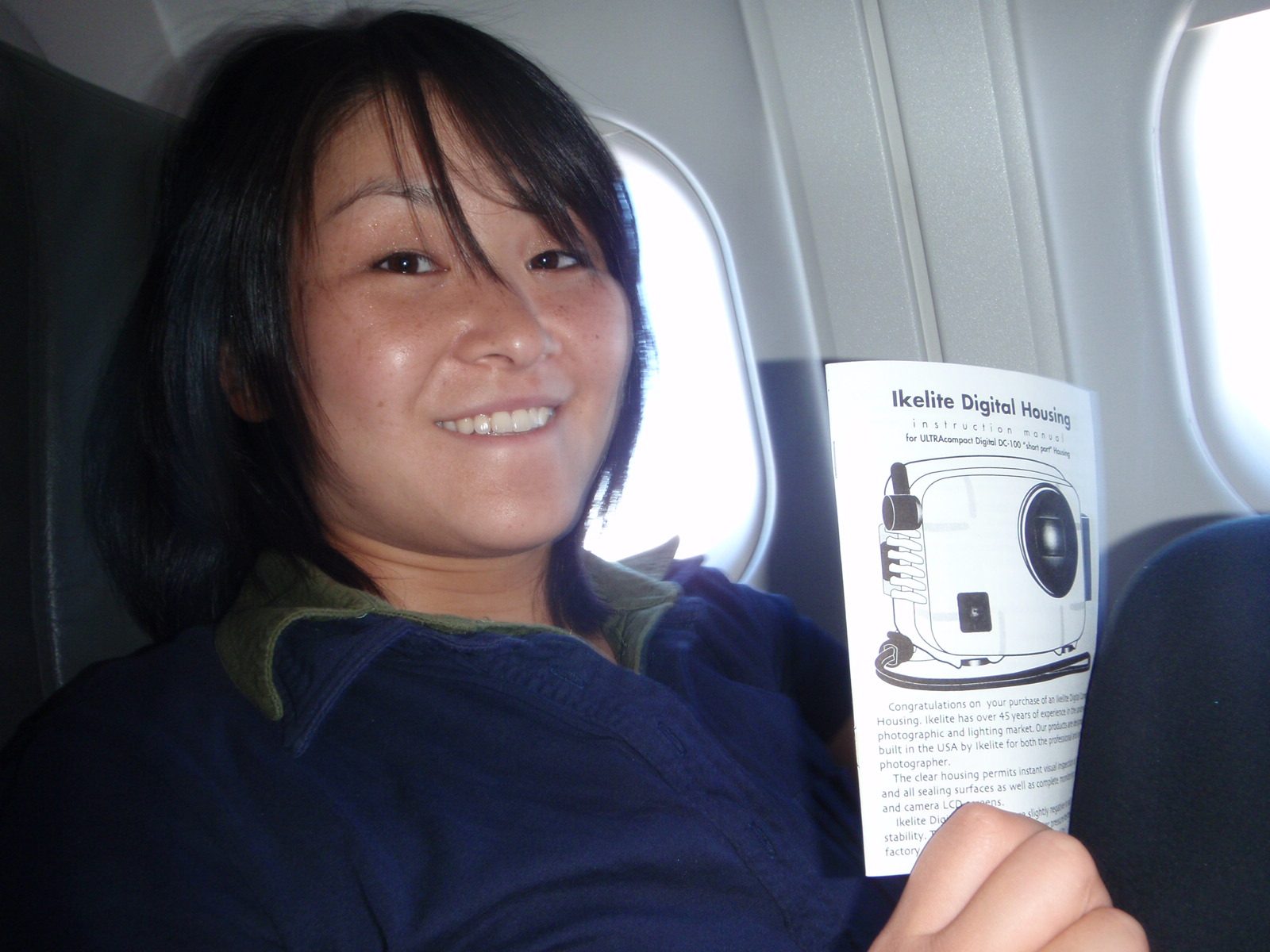Monica reads about my new SCUBA camera housing on the plane as we fly from San Francisco to...