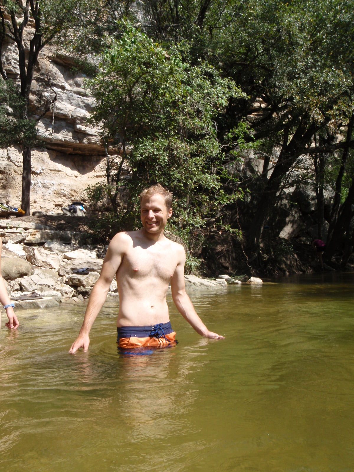 John, wondering where his wetsuit is. This water feels cold! But the air is so hot!