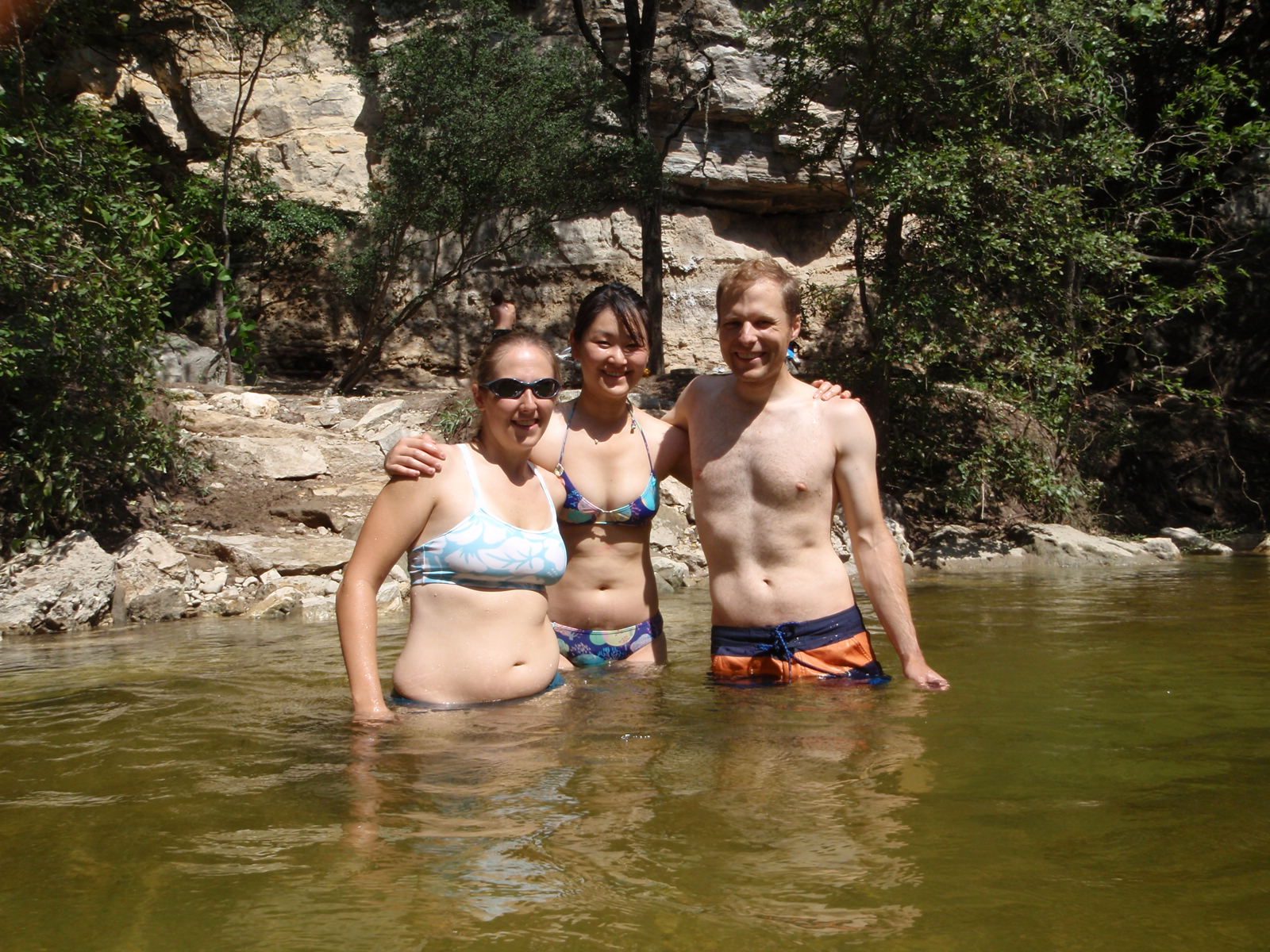 Catherine, Monica and John in Barton Springs. New Wall is visible in the background. Basically...