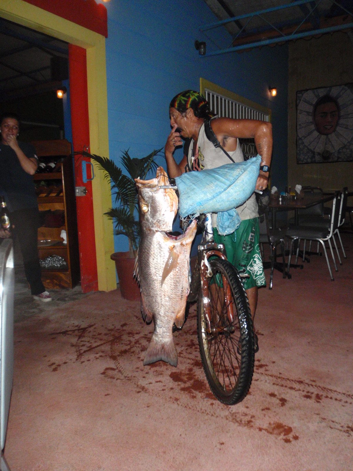 That night we went to a restaurant and while we were eating, a man came to sell the restaurant a fish.