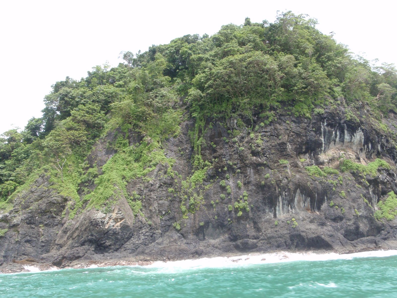 Back on the dive boat. Picture of the island near where we were diving.