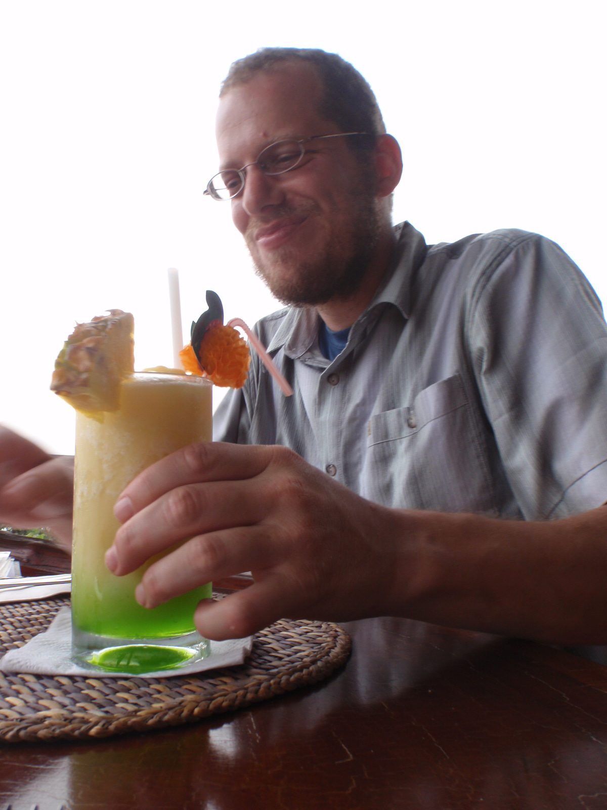 Joel drinking something with midori in it. I think it had coconut and pineapple too, despite...