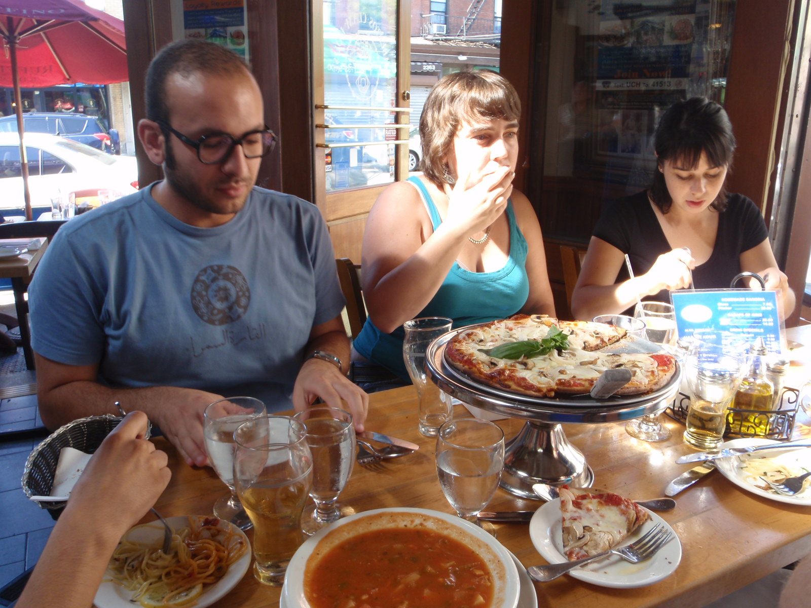 Eating lunch at a restaurant on Arthur Avenue in the Bronx. Laura is in the middle.