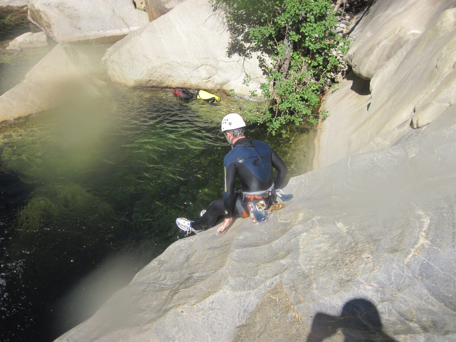 Colin sliding into a pool. See that triangle shaped rock near the upper left, partially obscured...