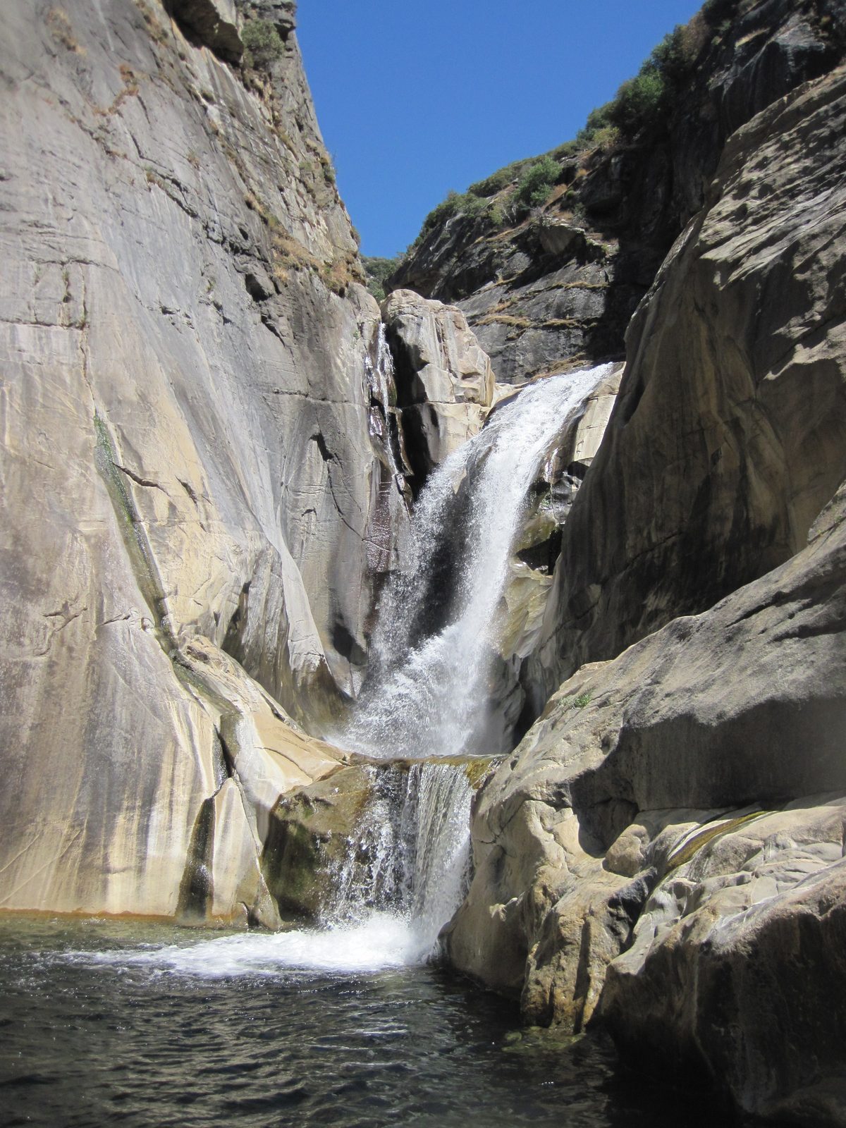 There is an optional fifty foot jump from the highest sloping ledge at the upper right, into the...