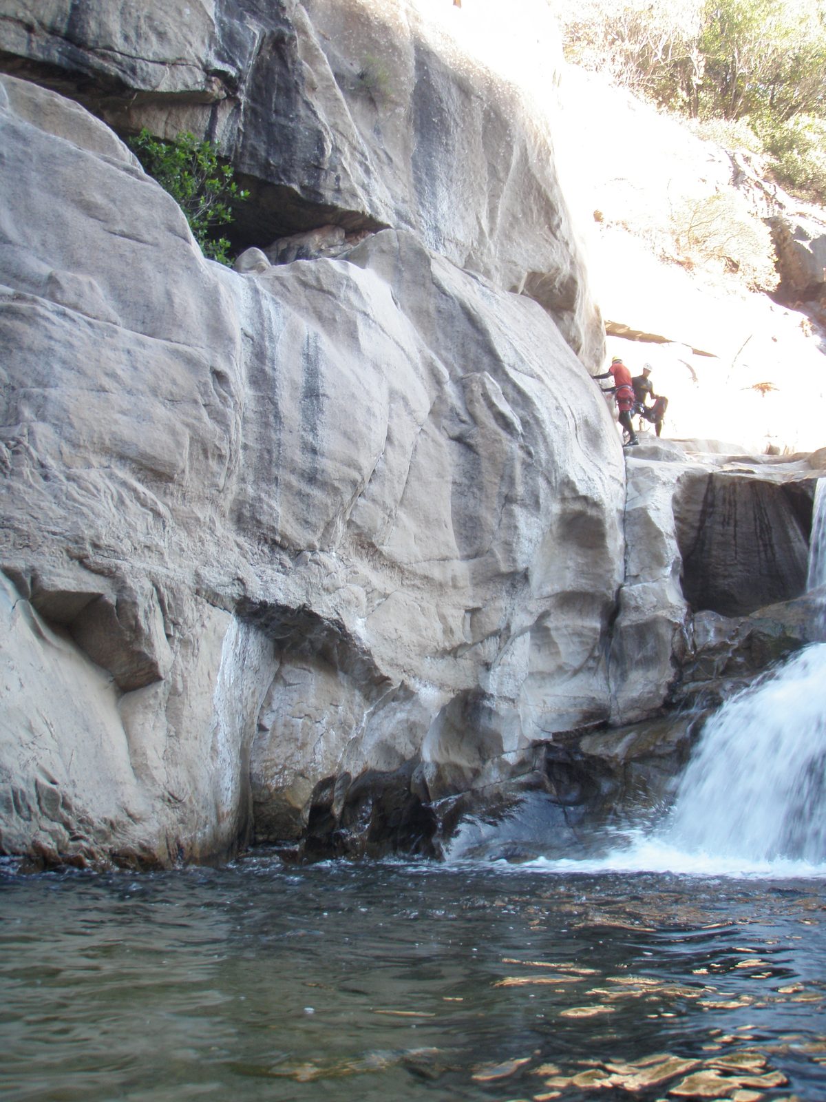 John climbs to the ledge first.